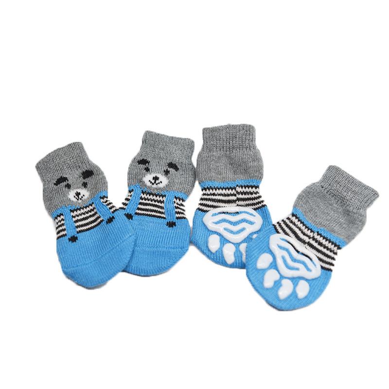 Four-pack of autumn/winter cartoon anti-slip socks for pets, including cat and dog warm socks with paw prints, perfect as a holiday gift.