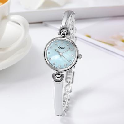 Schlichtes Design, kompakte und exquisite Armbanduhr mit rundem Zifferblatt, modische koreanische Version, vielseitige Quarz-Studentenuhr
