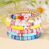 Korean version of fashion new multi-layer elastic thread soft pottery love smiley face bracelet set retro handmade pearl jewelry women