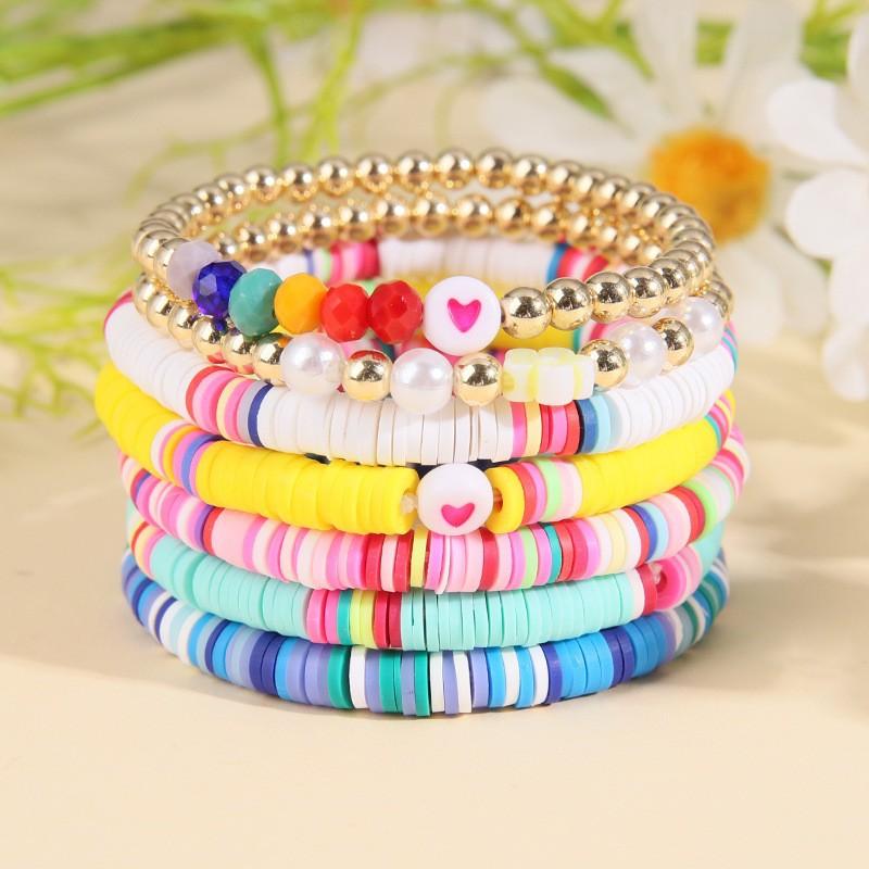 Korean version of fashion new multi-layer elastic thread soft pottery love smiley face bracelet set retro handmade pearl jewelry women