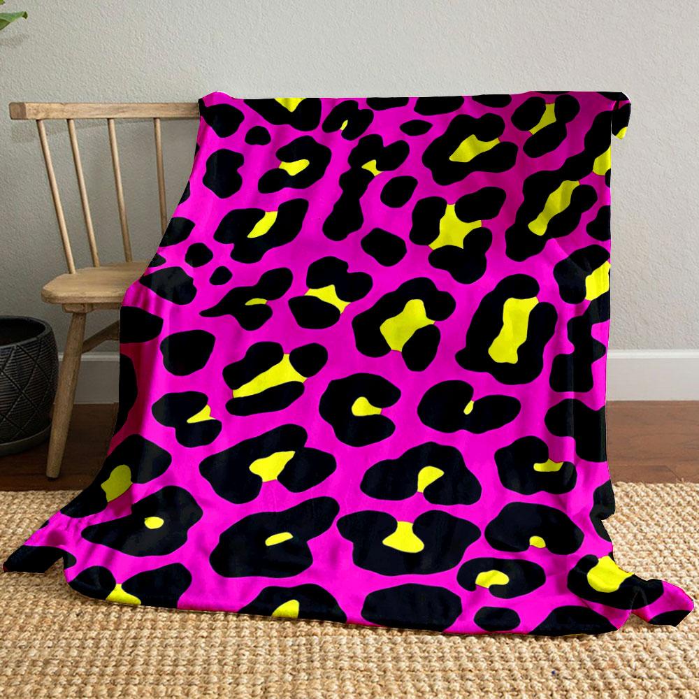 Bold leopard print with black spots, yellow centers, on a pink background. for all seasons blanket lunch break throw gift