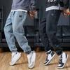 Herren Frühling und Herbst Dünnschliff Lose Kordelzug Lässige Stretch Arbeitshose Jeans