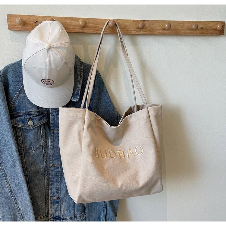 

Japanese casual embroidered bag 2025 new large-capacity versatile commuter shoulder bag college student class tote bag 47*19*30 хаки