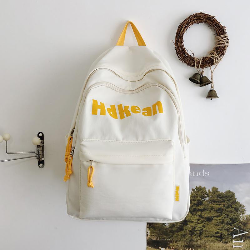 New High-value Solid Color Simple Letter Backpack Couple Casual Lightweight Large-capacity Backpack