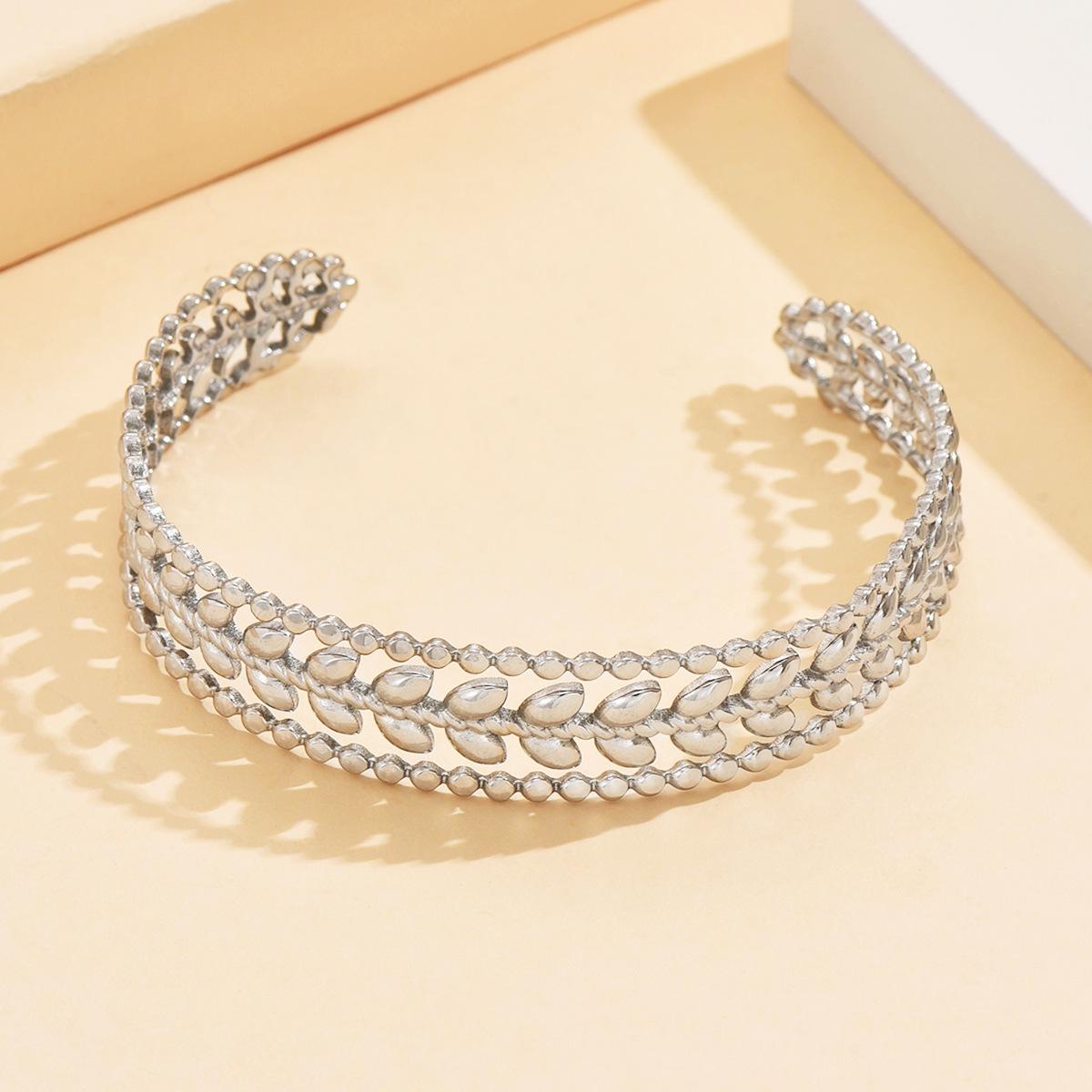 Versatile Fresh Leaf Open Adjustable Stainless Steel Bracelet with Elegant Hollow Leaf Design