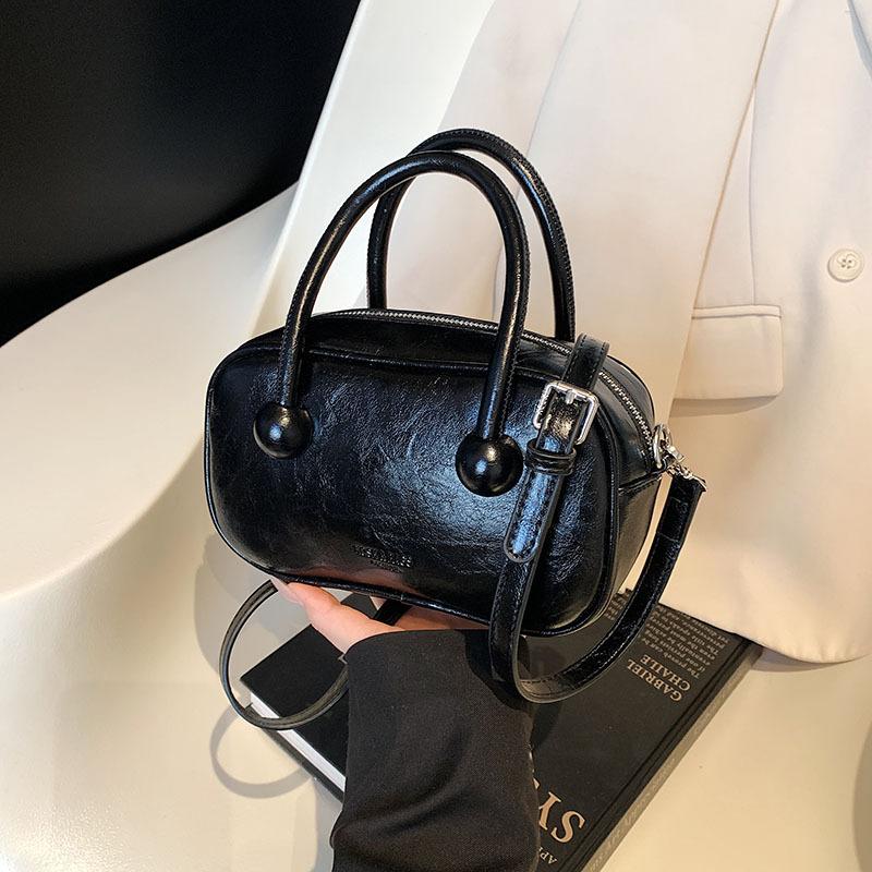 Hand-held bowling bag 2025 new fashion simple shoulder bag high-end niche women's bag