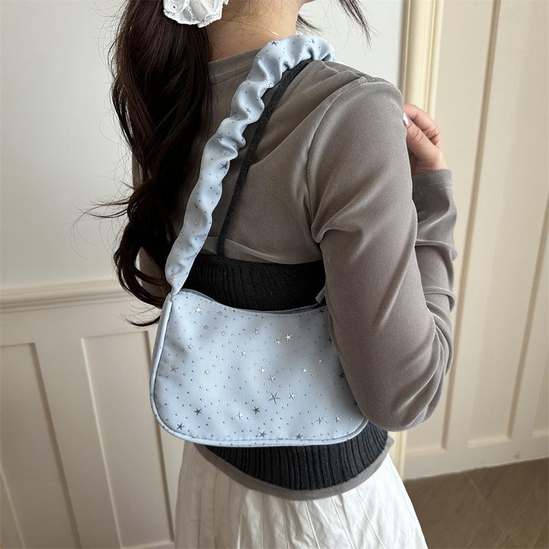 Nischen-Design Stern-Achseltasche Damen neue gefaltete Umhängetasche Pendlertasche High-End vielseitige Canvas-Tasche