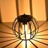 Solar Wrought Iron Lantern Light: Retro Mesh Pendant for Outdoor Garden, Courtyard, and Balcony Ambiance.