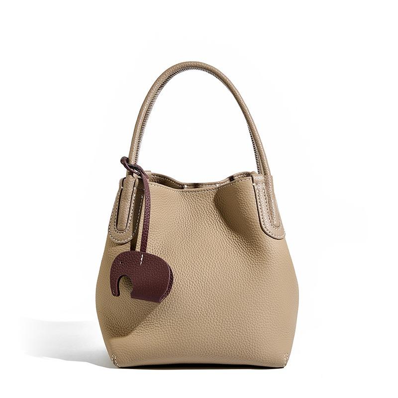 Summer new fashion leather bucket bag niche first layer cowhide retro single shoulder diagonal span portable vegetable basket bag