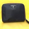 Used Excellent condition PRADA dry plum color bi-fold wallet with triangle logo plate and zipper