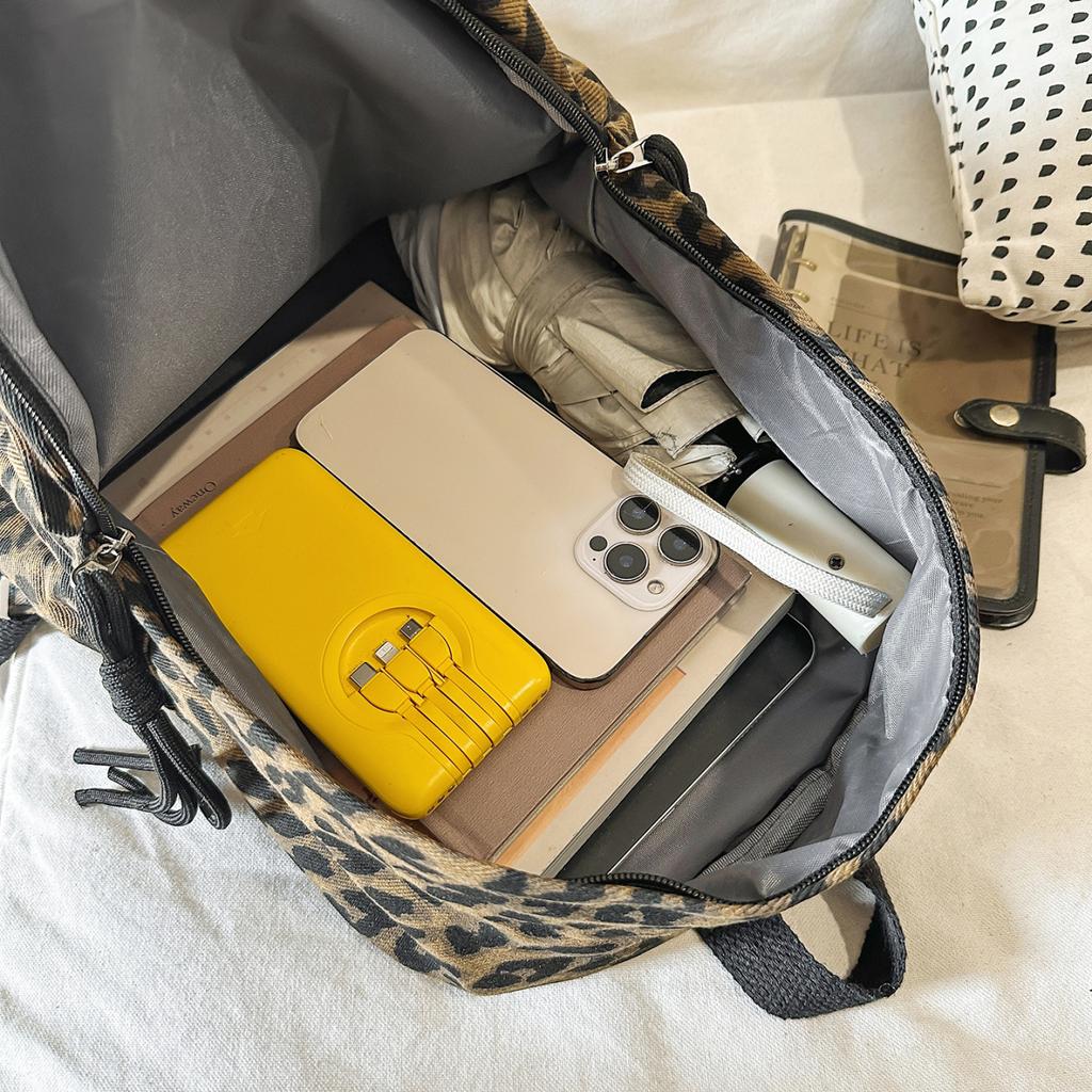 Leopard Print Backpack Casual Daily Use Trendy Street Style Lightweight Backpack for Women with Tassel Detail for School Travel and Everyday Outings