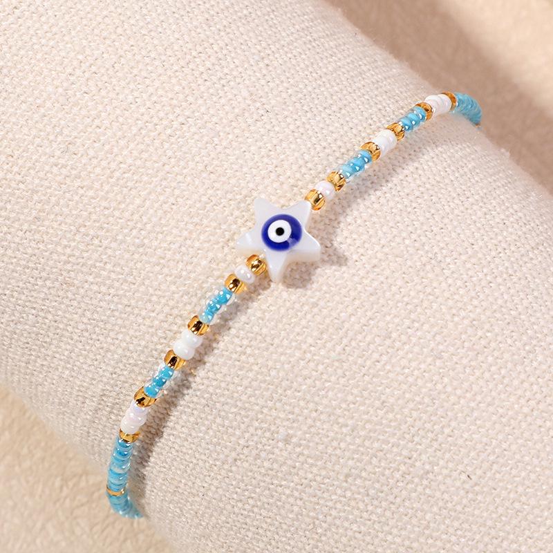 Bracelet en perles d'œil du diable tissé à la main avec motif de niche en verre