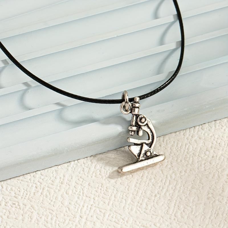 

A retro pu material microscope alloy material pendant necklace retro elegance