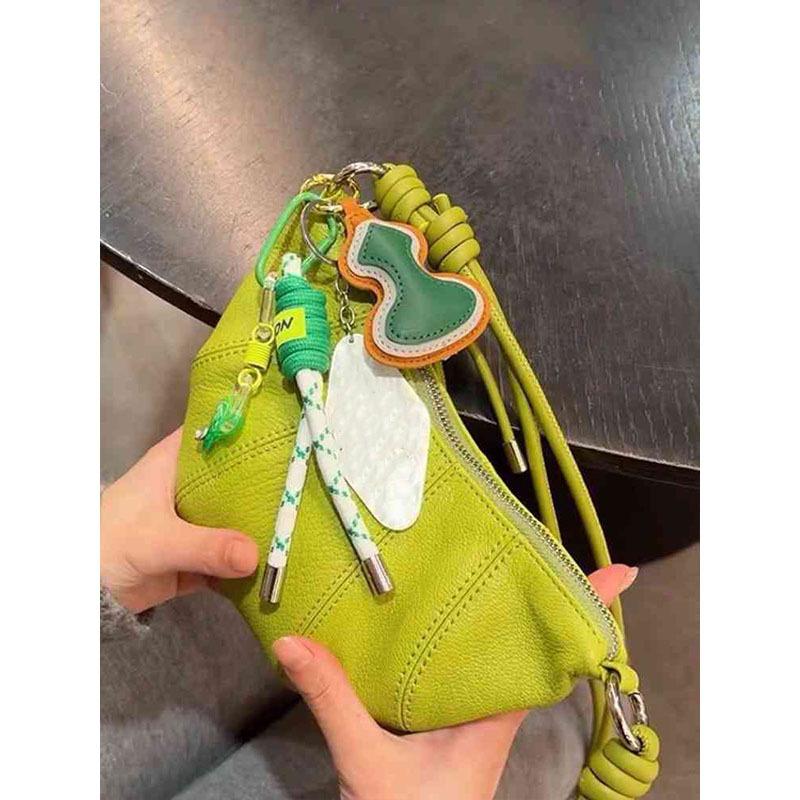 

Green PU leather horn bag women s 2025 new light luxury niche high-end commuting shoulder crossbody dumpling bag