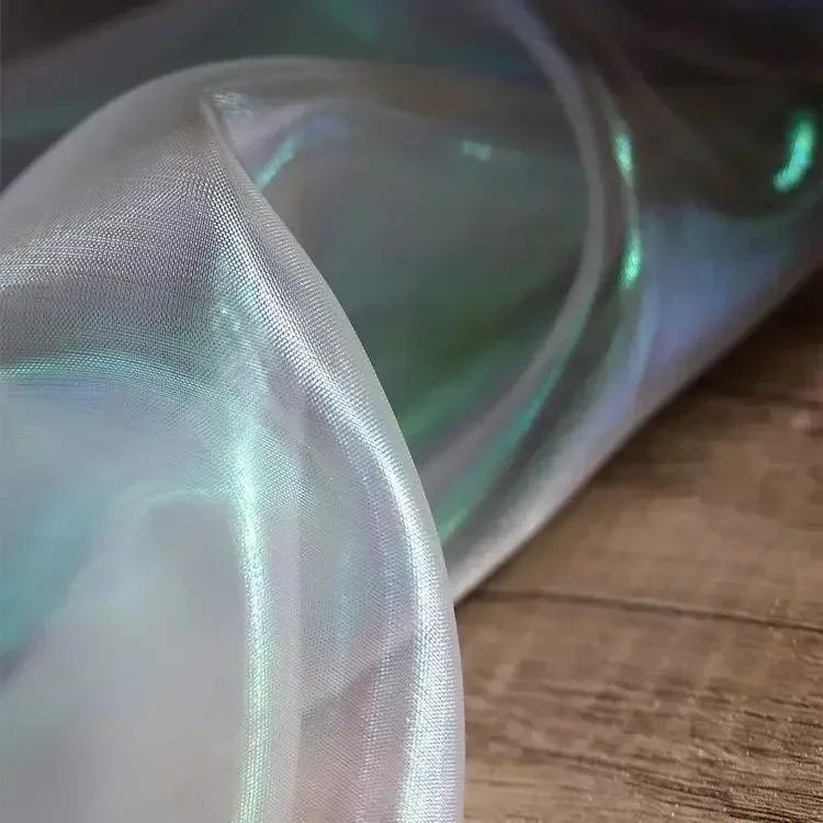 Buntes glitzerndes Netzgewebe Illusionäre Farbfotografie Hintergrund Transparentes Gaze-Kleid Performance-Kleidung Stoff