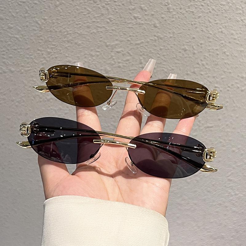 New elliptical frameless metal temple YK knot women's sunglasses personalized street shot Internet celebrity sunglasses