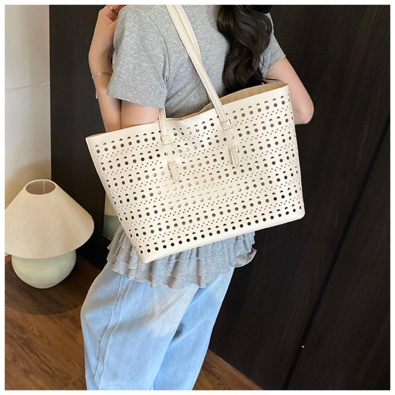 Large-capacity tote bag niche design simple hollow bag women's summer new versatile shoulder bag