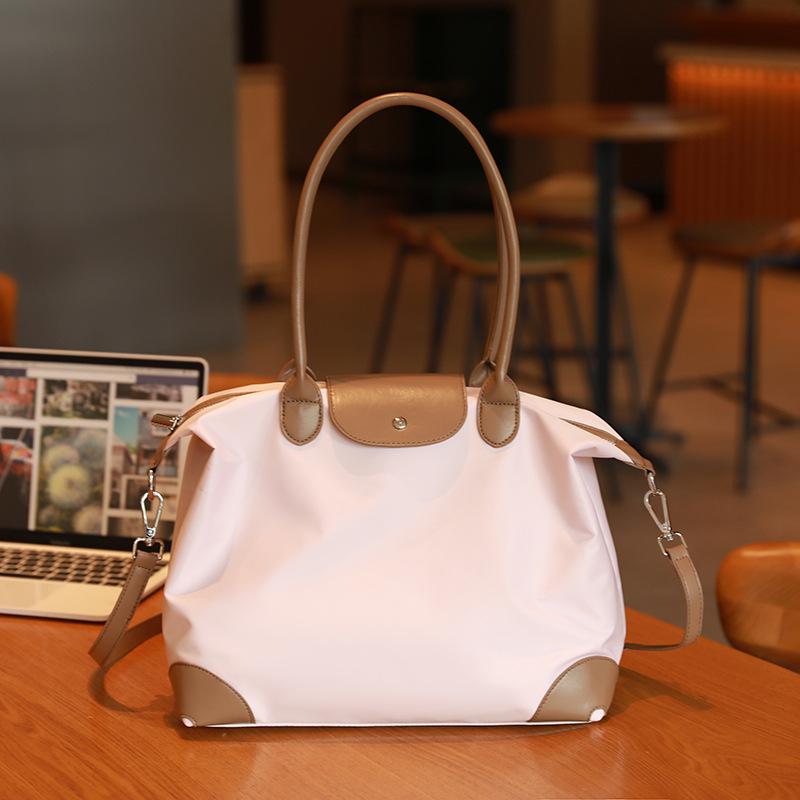 Simple Casual Women's Dumpling Handbag: High-End, Large Capacity, Crossbody & Commute Bag