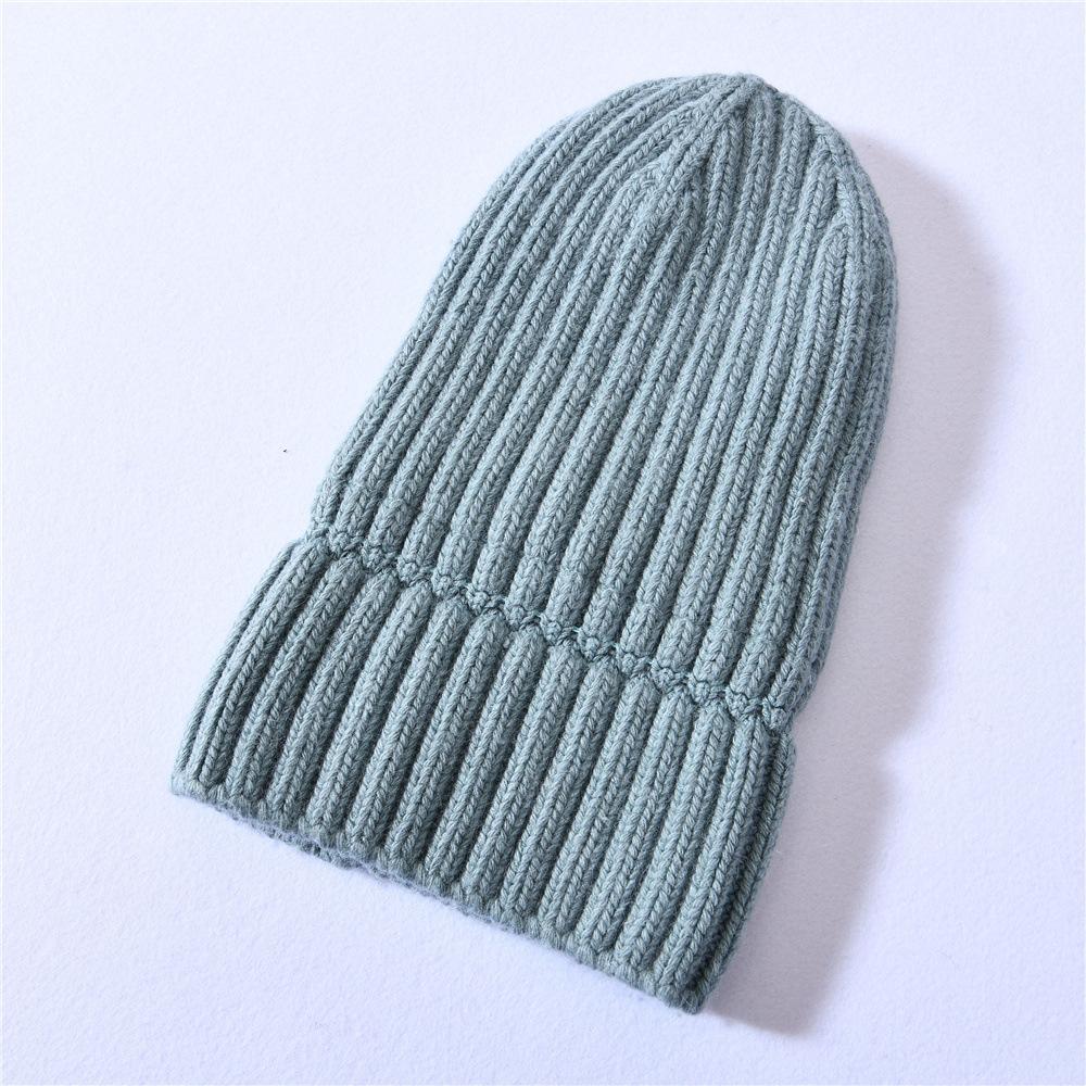 Versatile series big children's rabbit down knitted hat solid color lined outdoor satin lining wool hat warm ear protection