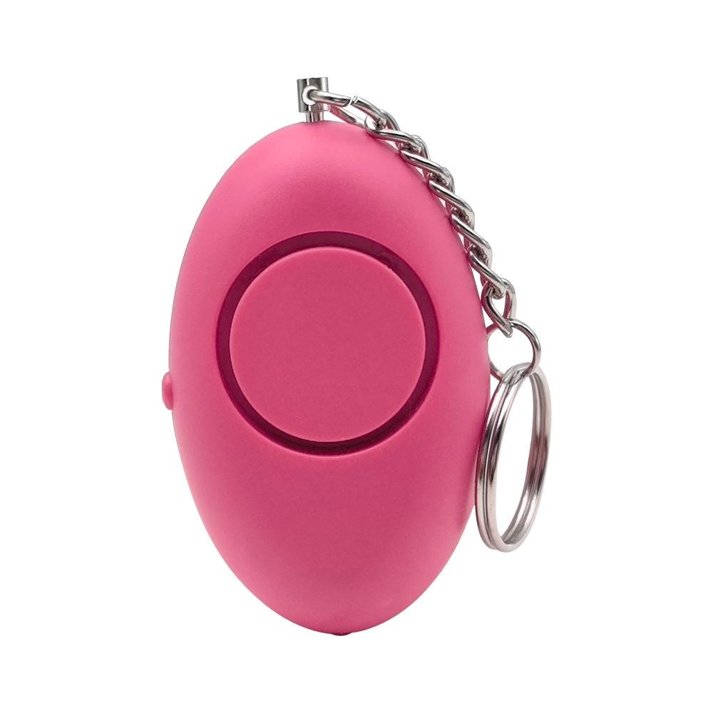 Oval Personal Alarm Keychain: Safety Self-Defense Device with LED Light for Women, Outdoor Use, and Wolf Repellent. маджента
