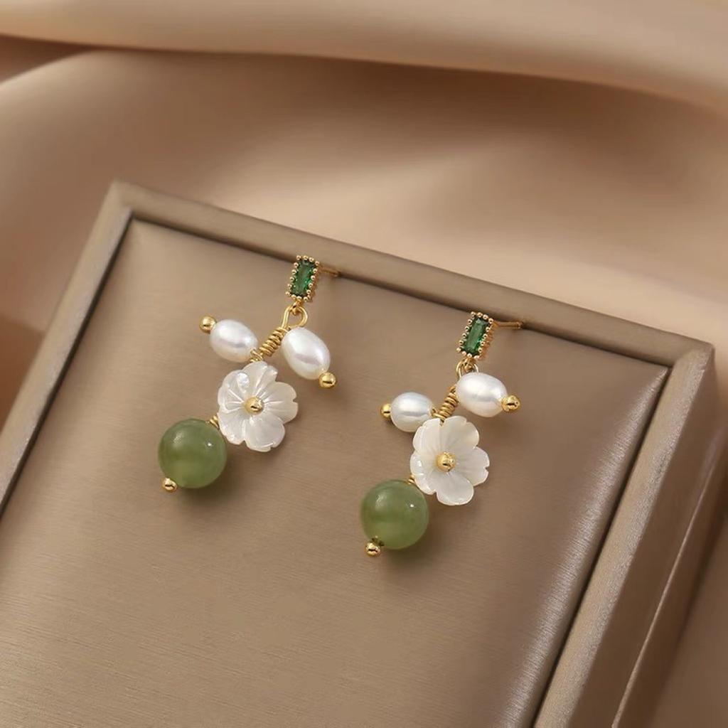 Gentle and elegant natural Hetian jade flower earrings women's handmade winding pearl stud earrings S925 silver needle niche temperament