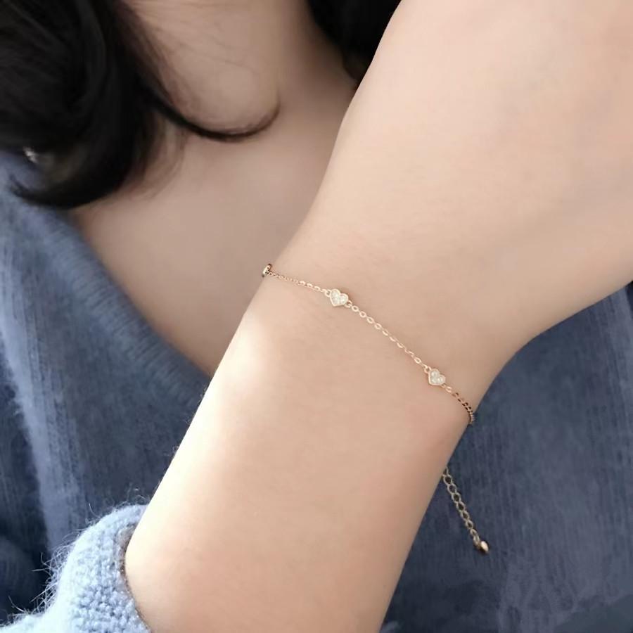 Japanese S925 Sterling Silver Heart-Shaped Bracelet with 14k Gold Plating, Featuring Three Small Cold Style Hearts. Simple and Elegant Design.