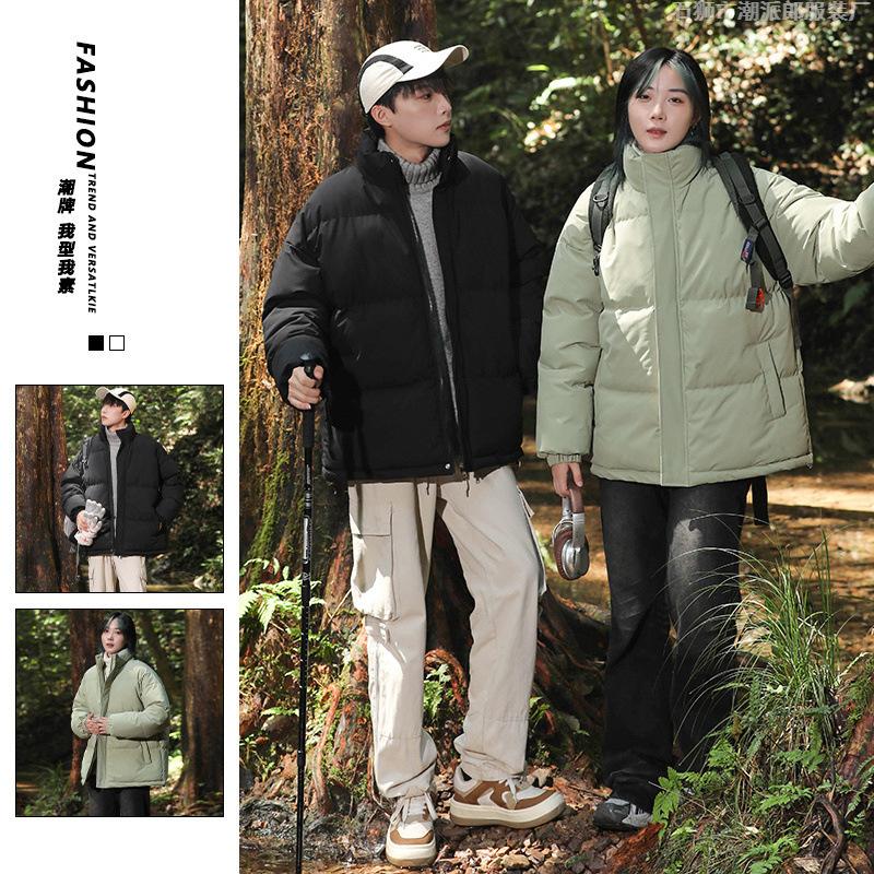 Large size cotton-padded clothes are the same for men and women. Winter thickened stand-up neck cotton-padded jacket, loose thickened cotton-padded 