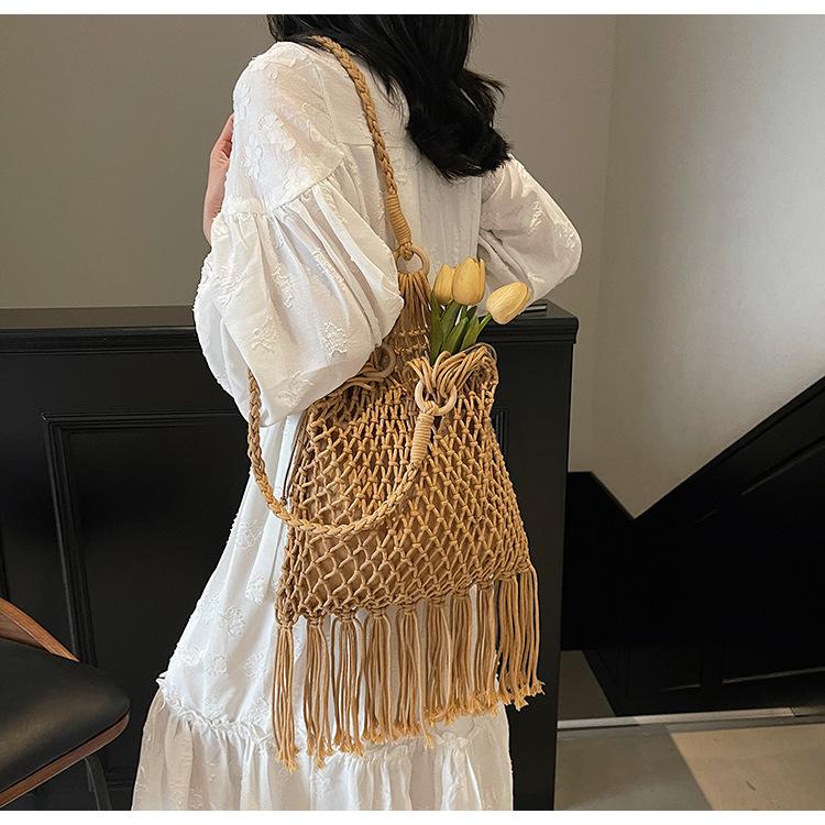 New Straw Bag Handbag Diagonal Span Hollow Women's Bag Beach Bag Single Shoulder Fashion Hollow Fringed Armpit Bag