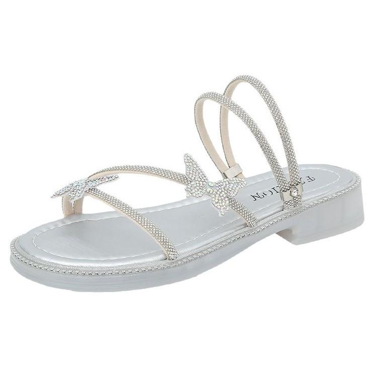 Beautiful slippers female 2025 summer wear new Internet celebrity butterfly rhinestone one-word drag fairy wind beach two sandals