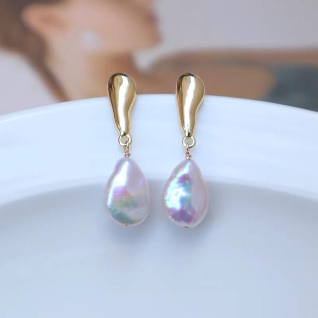 

Baroque, natural melon seeds, water drop-shaped buttons, pearl colored light, baroque silver needle temperament stud earrings, simple and niche Silver needle