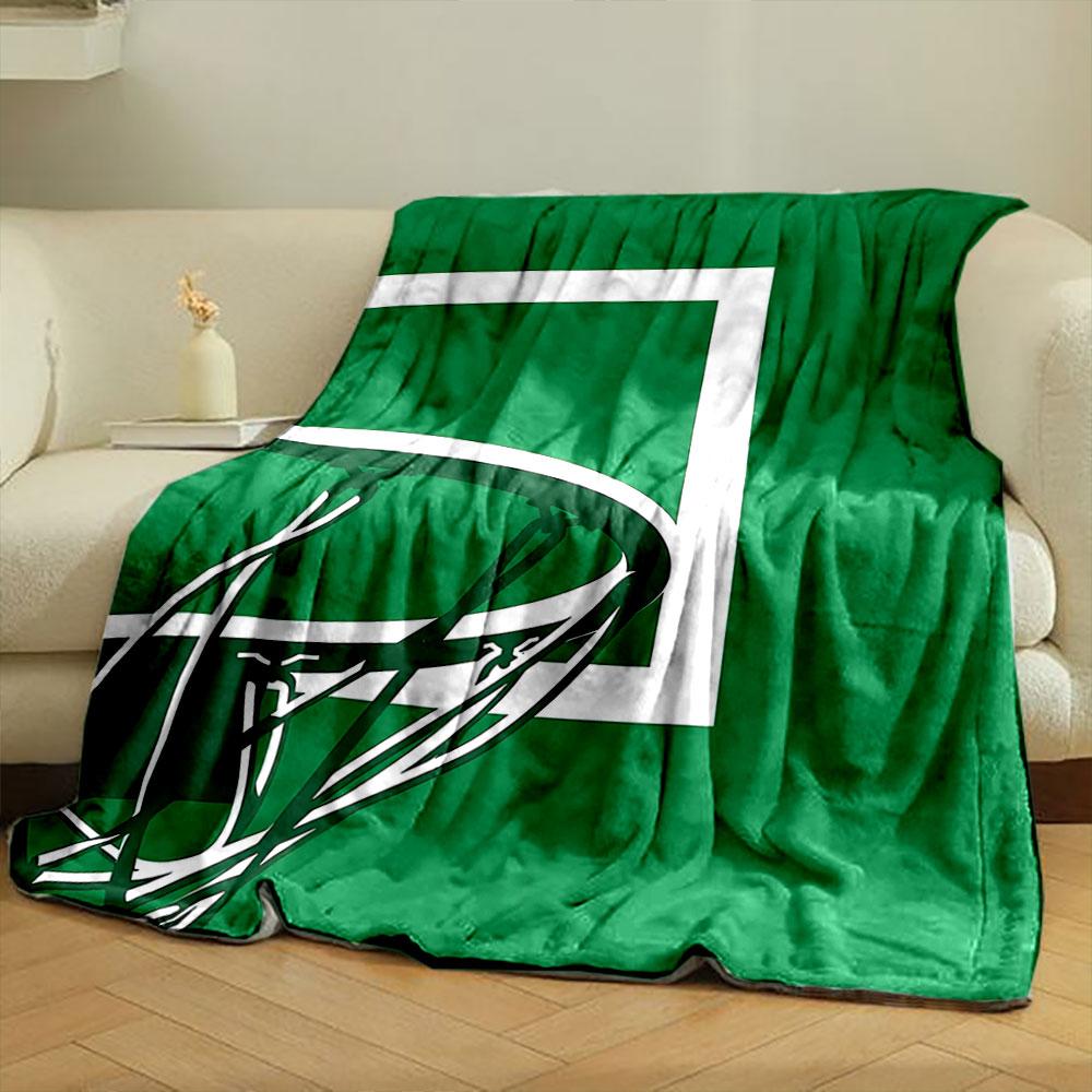 Basketball hoop and net silhouetted against a green background. for all seasons blanket lunch break throw gift