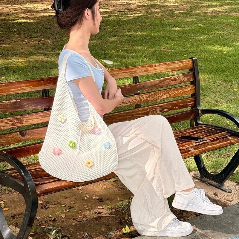 Beach bag single shoulder tote bag women's hollow new Korean version knitted woven bag flower lazy wind