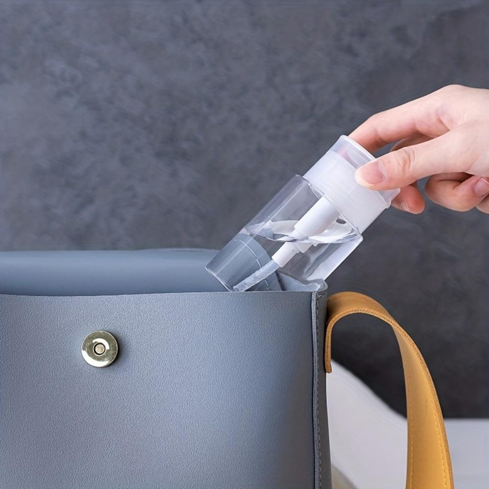 2 clear pump bottle dispensers press-down reusable travel bottle set for makeup, nail polish cleaning, cosmetics storage.
