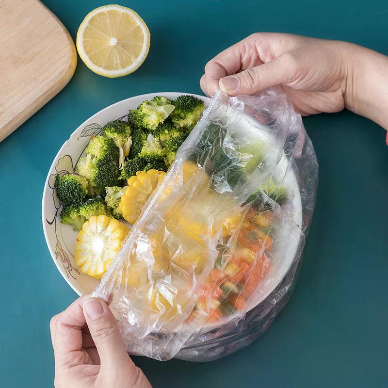 Herbruikbare wegwerpvoedselafdekking Plastic folie Duurzame elastische voedseldeksels voor kommen Elastische plaatafdekkingen voor keukenvoedselbesparende tas