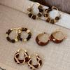 Boucles d'oreilles rondes en œil de tigre, nouvelles boucles d'oreilles puces populaires polyvalentes.