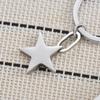 Porte-clés en acier inoxydable étoile à cinq branches Design 3D lisse Pendentif de sac tendance Porte-clés pratique ne se décolore pas