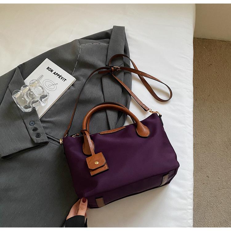 

Bag women s bag 2025 new portable nylon cloth light commuting large capacity tote bag temperament shoulder messenger bag фиолетовый