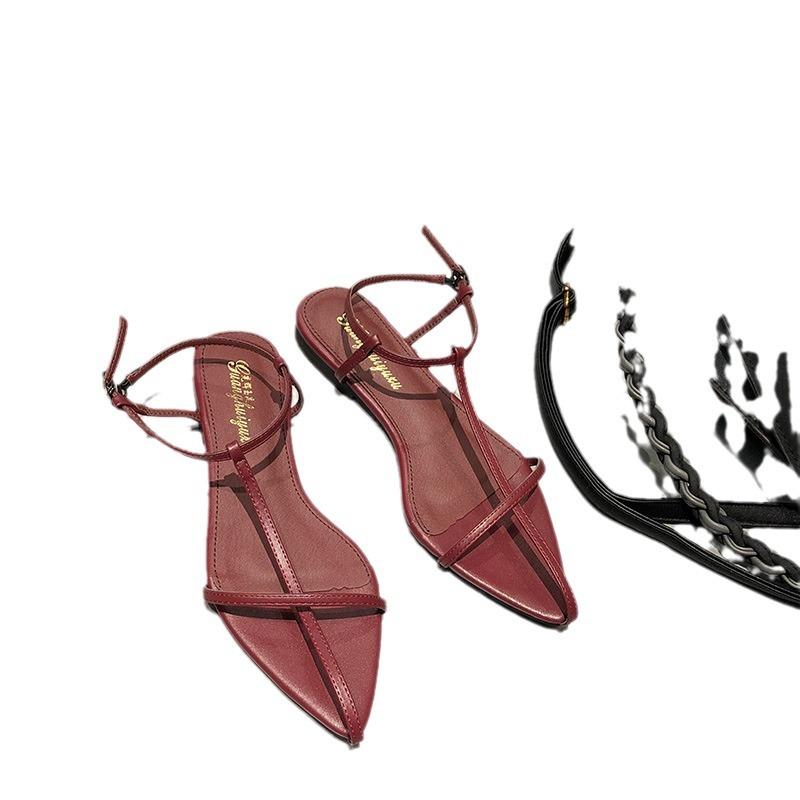 2025 sommar koreansk version spetsiga platta damsandaler en-ord tunn rem platt klack korsspänne romerska damskor
