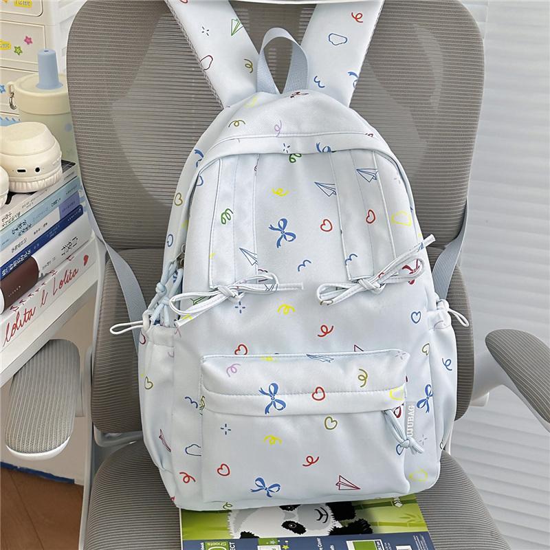 Cute Bow Tie Print School Backpack Lightweight Nylon Zipper Daypack with Front Pocket for Teen Girls Daily Travel