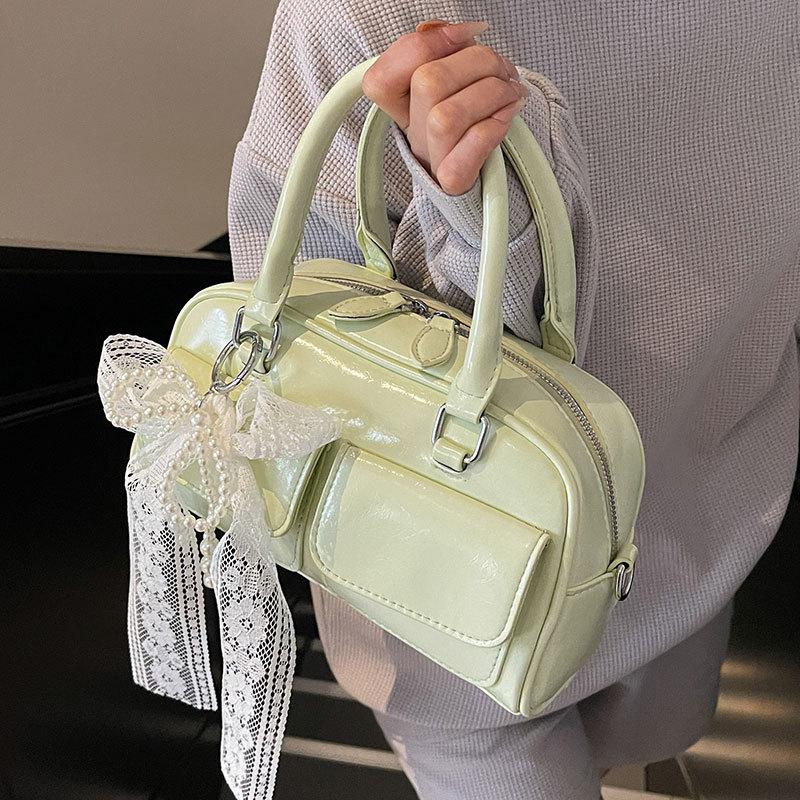 Korean version of the popular spring and summer dopamine simple portable Boston bag niche casual foreign style commuter messenger bag bag woman