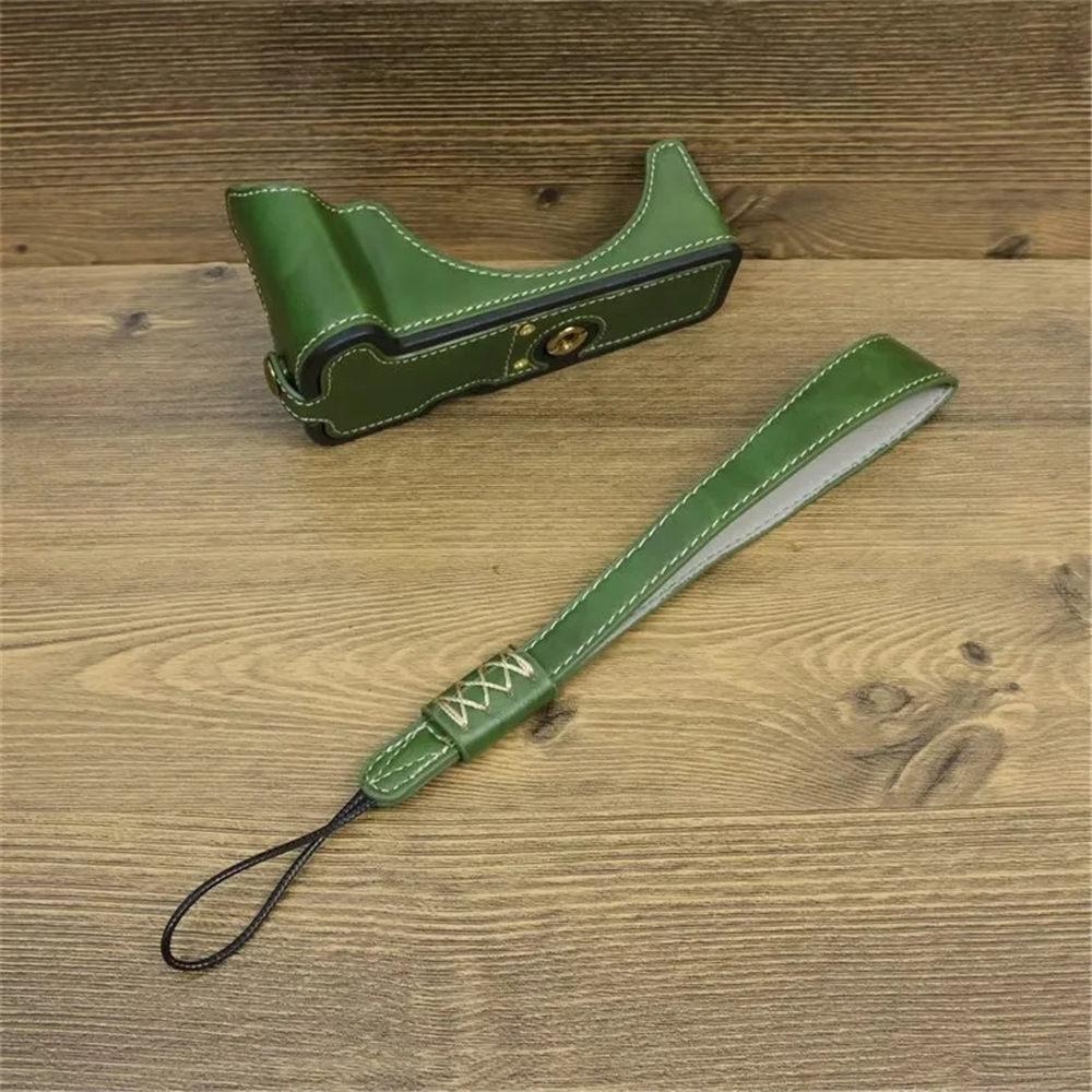 Półpokrowiec na aparat z PU skóry dla Canon EOS R50 R100, dolna pokrywa z paskiem na rękę, otwór na baterię