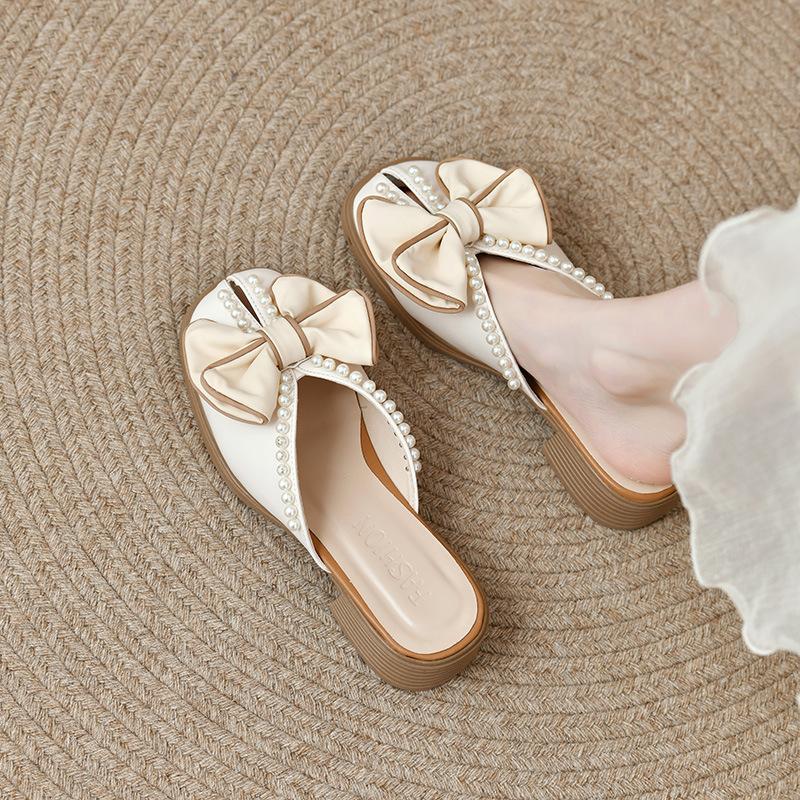 

Баотоу жемчужные полушлепанцы женские для улицы 2025 лето новые милые на среднем каблуке с бантом прохладные шлепанцы женские 40