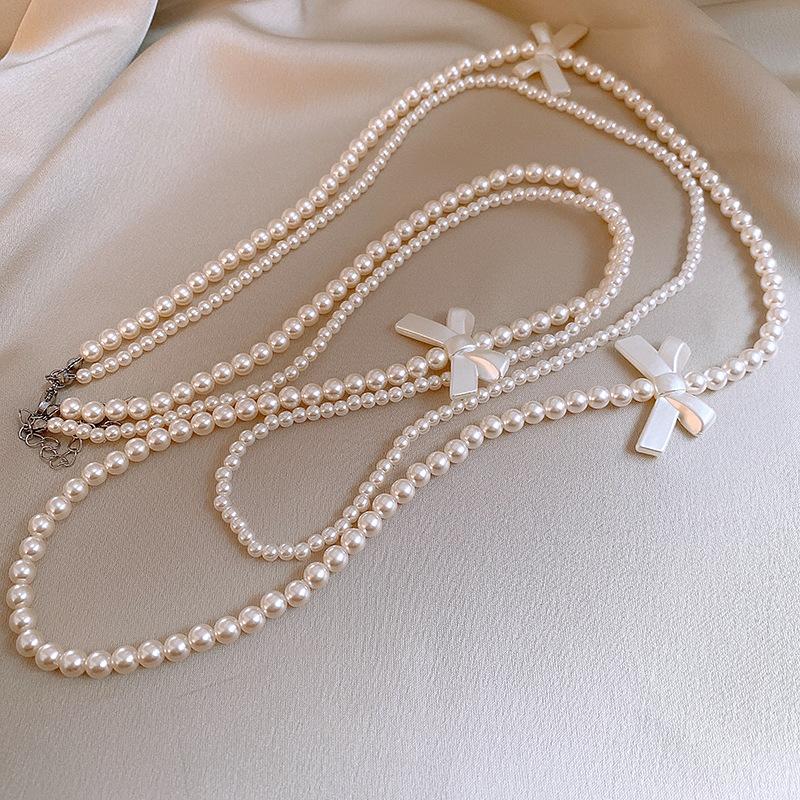 

Artificial pearl beaded bow necklace trendy stacked sweater chain French retro necklace