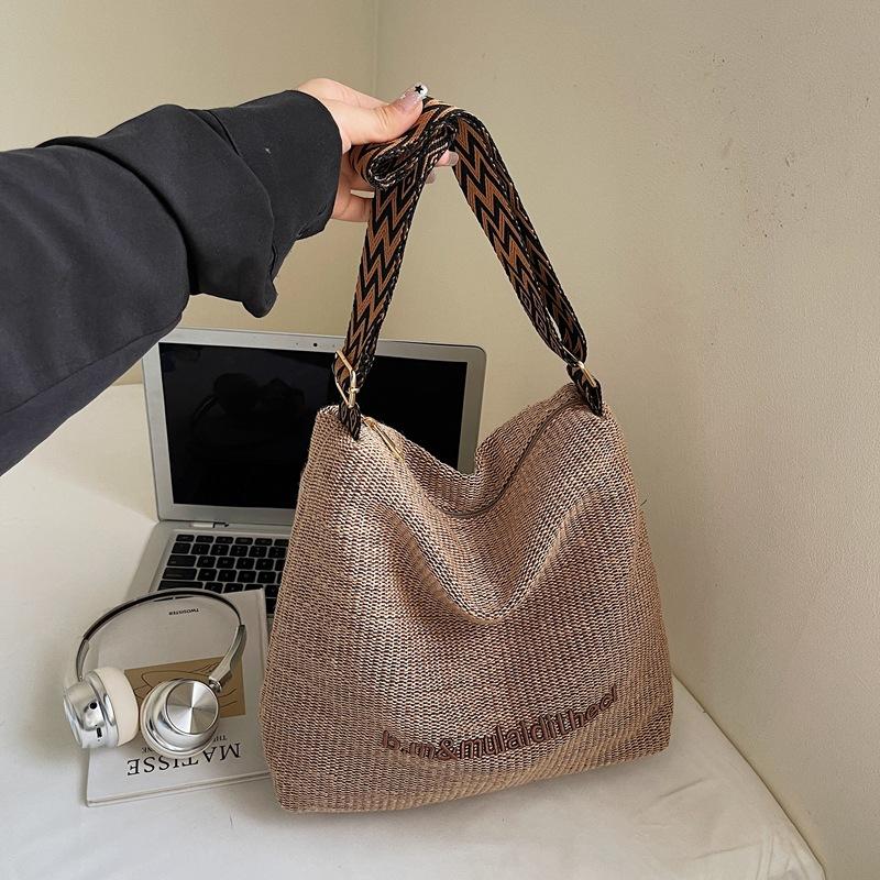 

Large capacity striped woven straw bag women s summer new shoulder crossbody seaside vacation beach bag