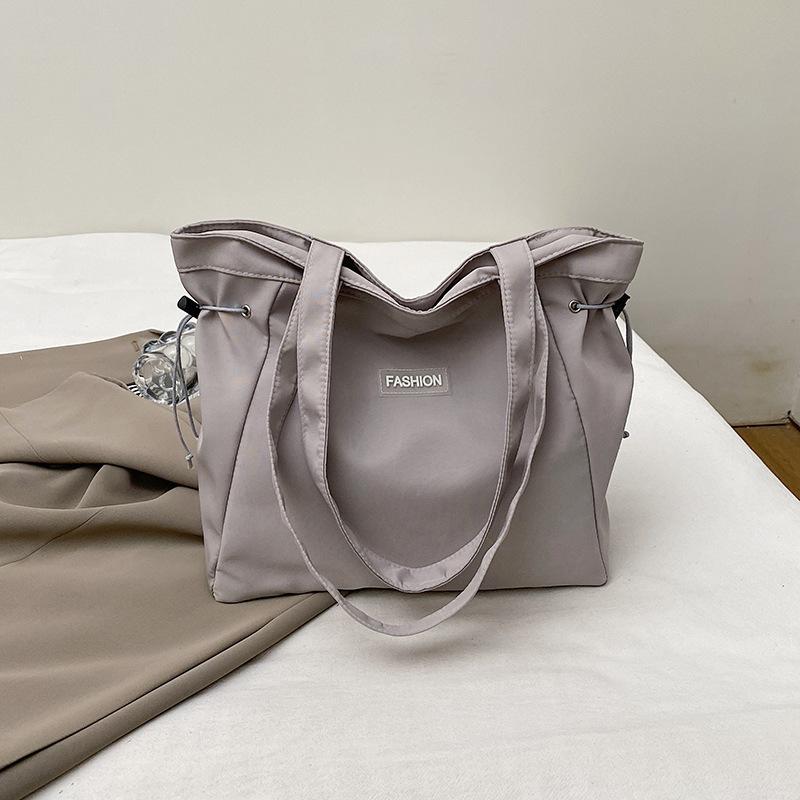 

Large capacity bag girl new canvas bag retro wind pumping belt casual bag college student tote bag underarm shoulder bag сірий колір