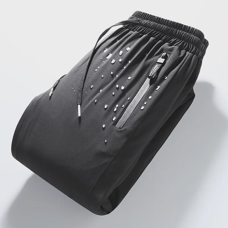 Pánské voděodolné zimní kalhoty s prachovým peřím z bílé kachny - Silné, hřejivé, odolné proti oleji, ideální pro venkovní aktivity na severovýchodě