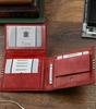 Men's wallet made of natural leather decorated with crosswise stripes