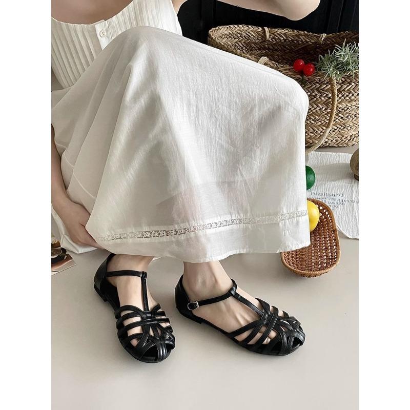 Soft-soled retro woven baotou sandals women's fashion flat-soled student pig cage shoes tide
