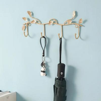 Kreativer Schlüsselbrett & Kleiderhaken - Wanddekoration. Ein leichter, luxuriöser Kleiderhaken aus Eisen für den Eingangsbereich, ein eleganter Kleiderbügel für den Eingangsbereich.