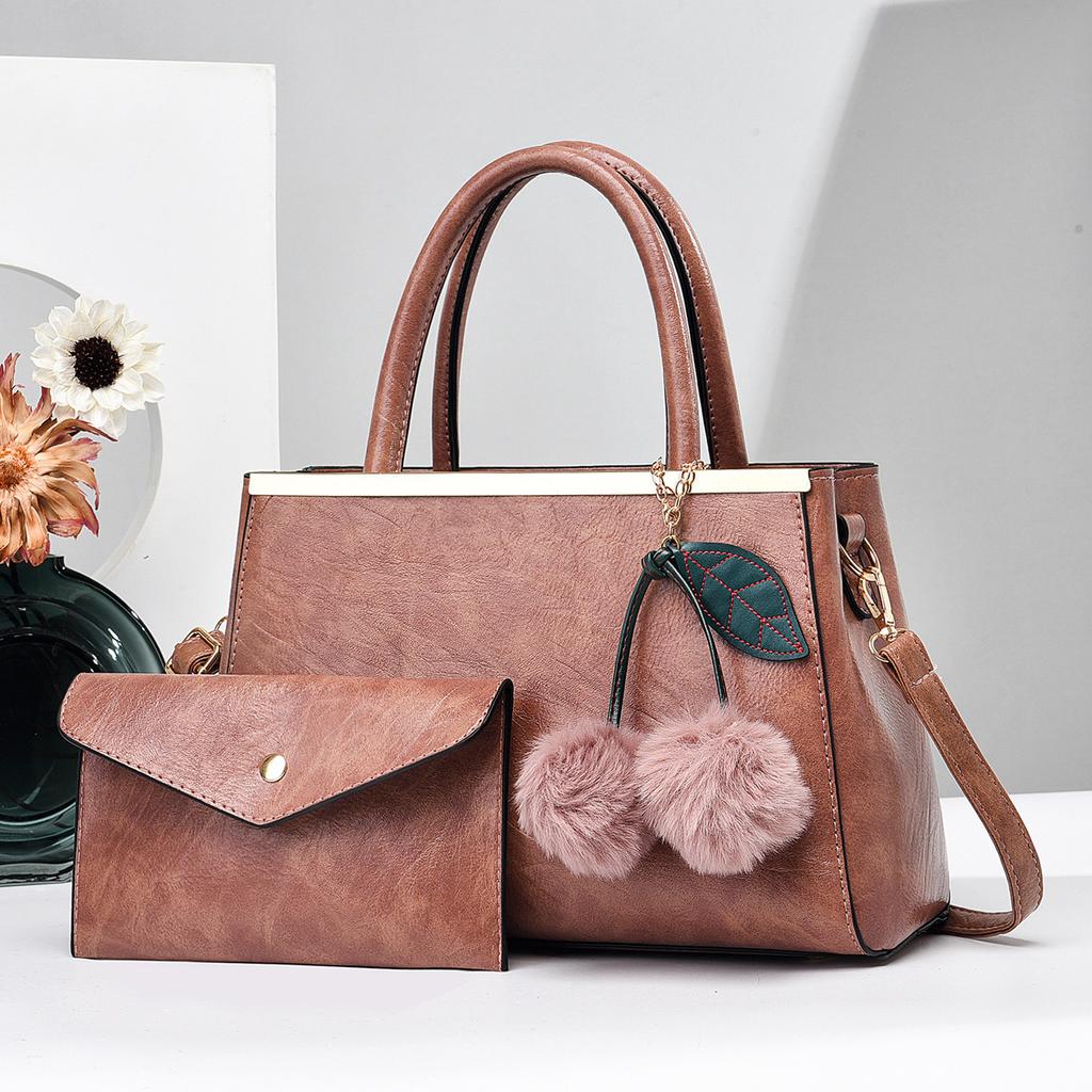 Einfache Elegante Damenhandtasche und Geldbörsen Neue Große Kapazität Fellbommel Anhänger Schultertasche High End Damen Umhängetaschen